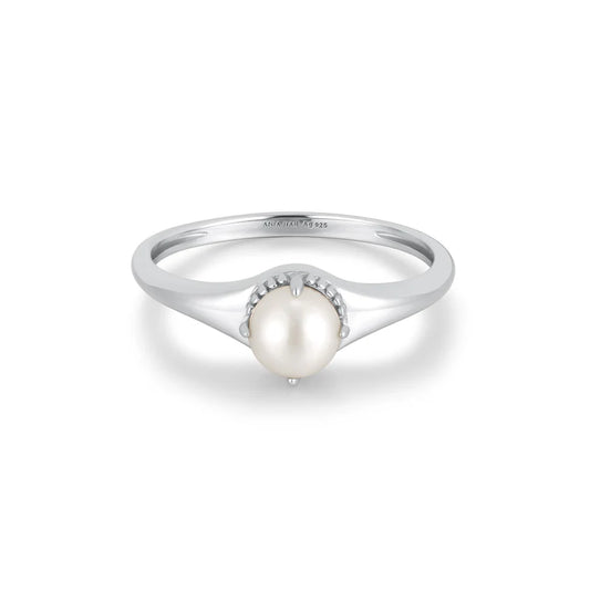 Silver ring with a pearl on a white background